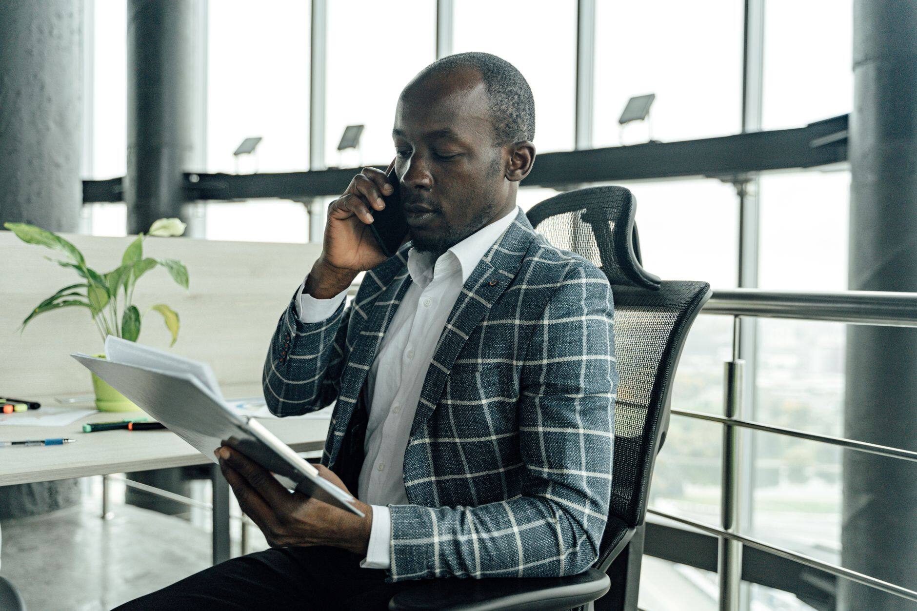A businessman on a phone call in an office